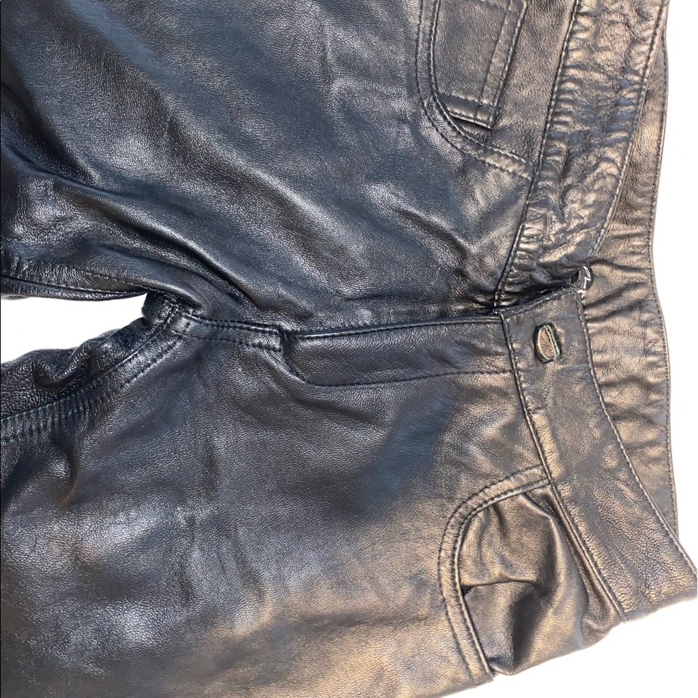 100% genuine leather black skinny pants w/ 100% polyester lining. Made in Italy